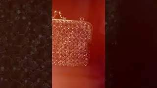 Wrapped in shades of blue and touched with champagne sparkle, this crystal bag is perfect