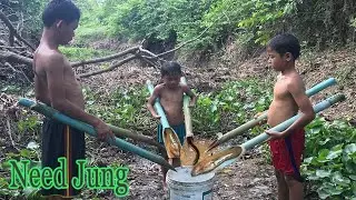 Three Boys Catching Eel Using Water Pipe Eel Trap - Need Jung