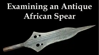 Examining an Antique African Spear Head