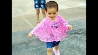 cute baby Girl following her sister