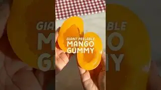 Пробую ОГРОМНУЮ жевательную конфету со вкусом манго, которую можно снять кожуру 🥭 @amossweets #ма...