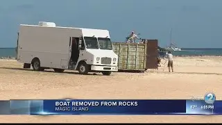 Sailboat salvaged from Magic Island rocks, lagoon closed indefinitely