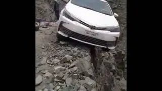 corolla slide to the edge of mountain //extremely dangerous//.murree roads.