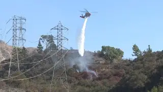 Firefighters continue to battle Los Angeles wildfires as strong winds threaten fight, AP explains