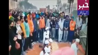 Sikh brothers standing in solidarity with Muslims while they offer namaz at the farmers protest.