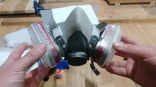Mascarilla respiratoria, con filtros intercambiables para polvos y vapor de solventes orgánicos.