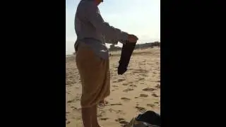 How to change from swim trunks to shorts on a public beach