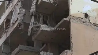 Officials clear debris and locals react to first Israeli strike on Lebanese capital in months