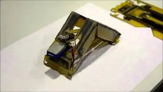 Robot Self-Assembly by Folding: A Printed Inchworm Robot