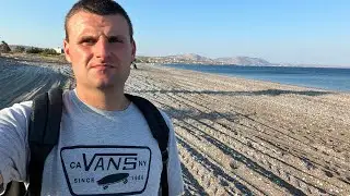 Me showing the shelless beach and clear sea water in Greece Rhodes