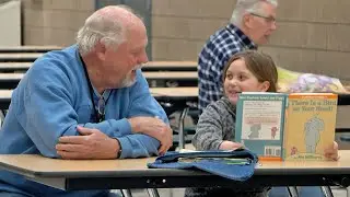 Golden Apple: 'Reading Buddies' Pairs Up Nevis Students With Community Members | Lakeland News