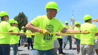 Volunteers raise the Star Barn