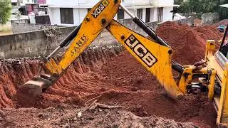 Jcb 3dx digging and moving soil for levelling land
