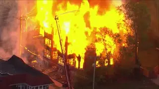 Building engulfed in flames near Forest Park