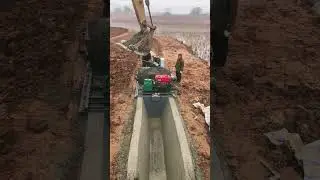 Construction of concrete irrigation canals- Good tools and machinery make work easy