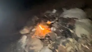 Fire at night in the woods after a bike trail ride scary experience