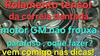 How to remove GM engine timing belt tensioner bearing when fixing bolt won't come out?