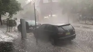 Streams of Hail Flow Down Street as Storms Hit Sydney
