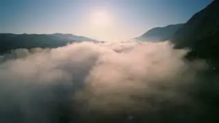 Hills and mountains at sunrise mist