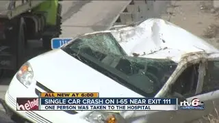 Car flips over guardrail on I-65