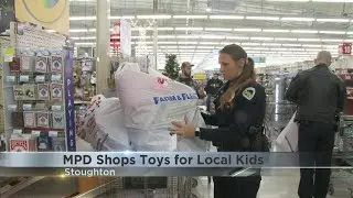 Madison police shop for toys to donate to local children for the holidays