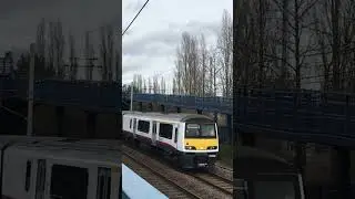 Rare class 321 passes with graffiti