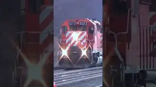 Pair of old CP SD40-2 engines hit the horn at 50 miles per hour.