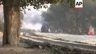 Afghan armoured vehicle set ablaze after hitting roadside bomb