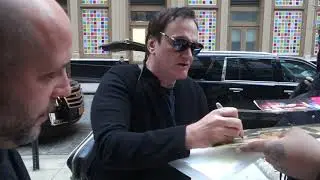 Quentin Tarantino signs autographs for fans