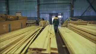 Construction wooden cottage. Measuring pine bars with the help of a corner tool outdoor closeup