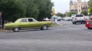 4 cars driving past the Queenscliff rod run show and shine 2023.
