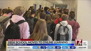 Georgia high school that went viral for crowded hall photo closes due to COVID-19