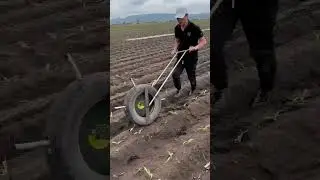 See How This Unique Fertilizer Spreader Made from Old Tires Works for Corn!