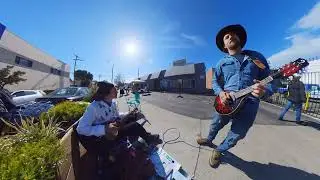 Another busker showed up with his own mandolin and cord, so we jammed!