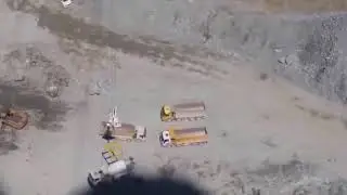 Concrete mixer truck lifted by Crane at Dam Construction site in Turkey