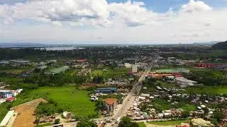 Road and streets in the town of Tacloban, Philippines. Car traffic, view from above.