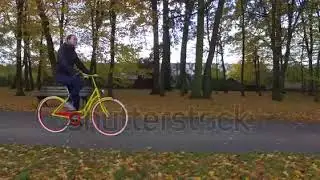 b stock footage beautiful girl cycling in colorful autumn park
