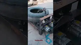 A dual motor tool cuts a tire