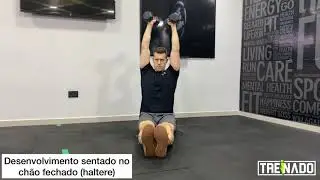 Desenvolvimento fechado sentado no ch&atilde;o (haltere)