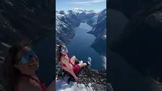 Lady Does a Forward Roll Before Sitting on Majestic Mountain&rsquo;s Edge