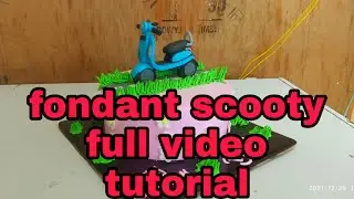 A #scooty cake topper, #Vespa cake , scooter theme .#blue scooty cake .#scooty kese bnaye fondant..👌