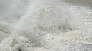 row of chute dentate blocks in concrete water spillway channel slope slowing down splashing flow of