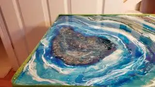 Geode coffee table in alcohol inks and resin.