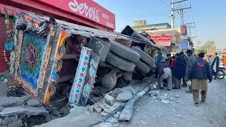 Out of Control! Loaded Truck Flips and Destroys Roadside Shops