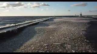 Ice Pancakes on Lake Michigan Lap Against Pier