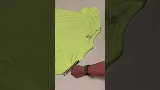 Cutting an 80s, off the shoulder t-shirt