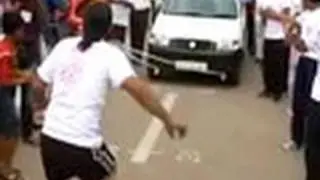 A man who pulls car with his beard