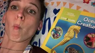 Mrs. Miller reads a National Geographic Look and Learn book 