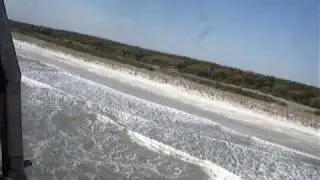 Flying alone the beach