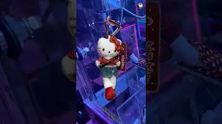 Hello Kitty in polka top & jean skirt